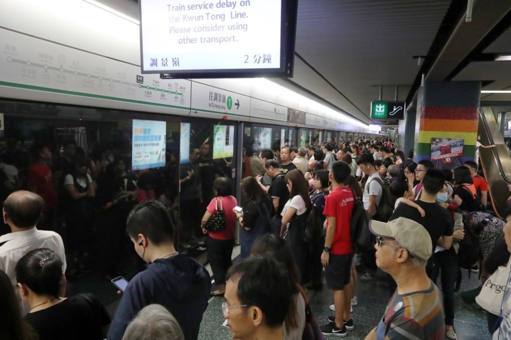 Commuters wait for the train at Choi Hung station after a signalling fault caused service delays for more than 10 hours on August 5, 2017. Photo: Edward Wong