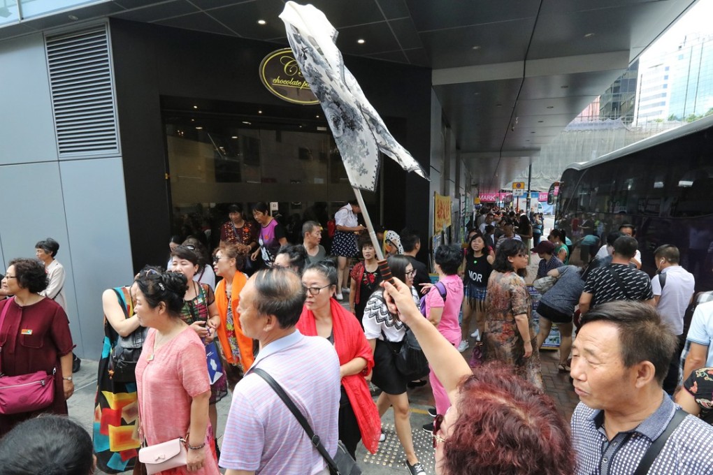 Mainland Chinese tourists at a shopping area in Tsim Sha Tsui on 26 September 2017. Visitors from China made up 76 per cent of the 58.5 million tourist arrivals in Hong Kong last year. Most came to shop for products and services that are unavailable in China, or which cost many times more. Photo: SCMP/ Felix Wong
