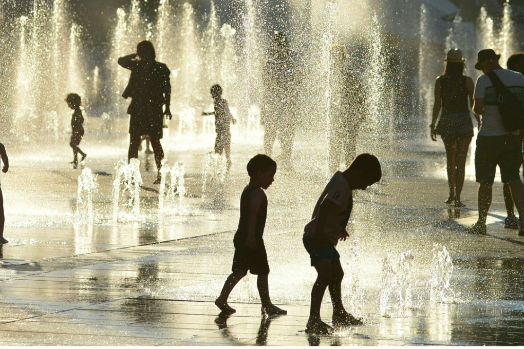 Children cool off in fountains at the Place des Arts in Montreal, Canada, in July. Picture: AFP