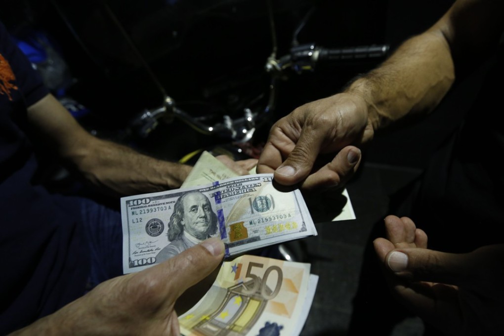 As Washington clashes with Tehran, bank customers in Hong Kong and mainland China are finding themselves caught in the crossfire. Photo: AFP