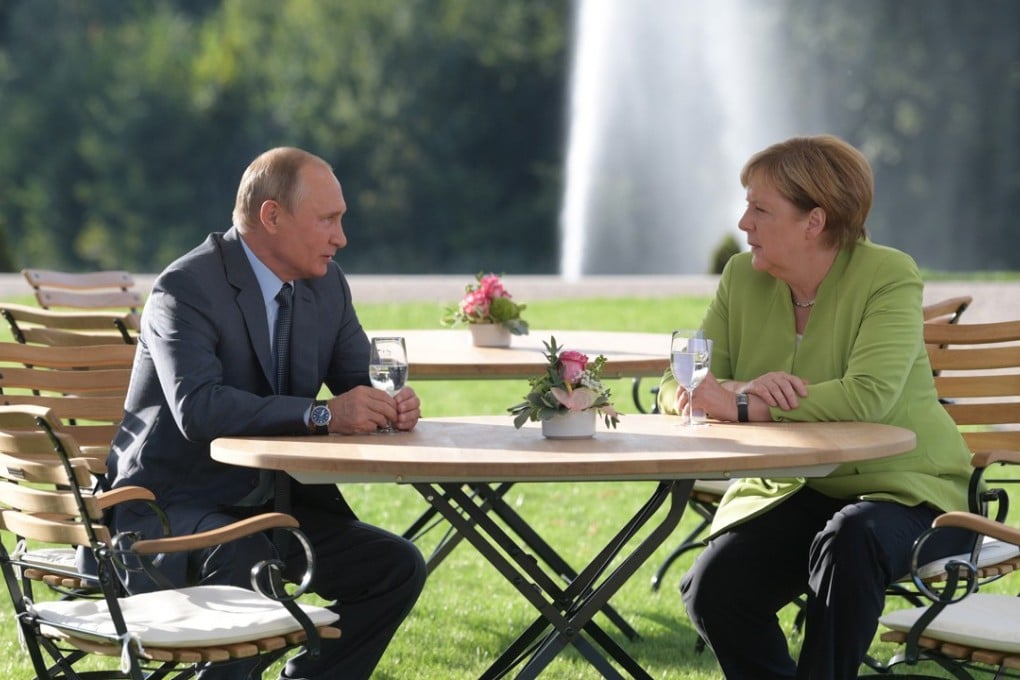Russian President Vladimir Putin, left, and German Chancellor Angela Merkel at the German government's guest house Meseberg Palace in Gransee near Berlin, Germany, on Saturday. Putin paid a working visit to Germany to discuss the development of German-Russian relations as well as international issues. Photo: EPA-EFE