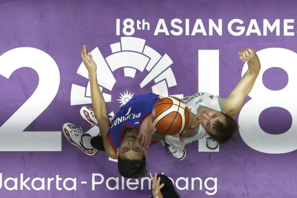 Philippines' John Erram (left) tussles with Kazakhstan’s Dmitriy Gavrilov. Photo: AP