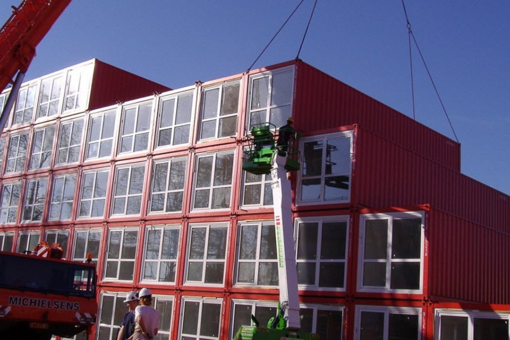 Prefabricated housing units being unloaded by crane in Amsterdam. Could they be part of the solution in Hong Kong? Photo: Tempohousing