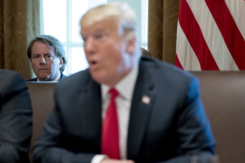 White House counsel Donald McGahn, left, listening as US President Donald Trump spoke during a cabinet meeting this month. Trump insisted on Sunday that McGahn isn't “a John Dean type 'RAT,'" making reference to the Watergate-era White House lawyer who turned on Richard Nixon. Photo: AP