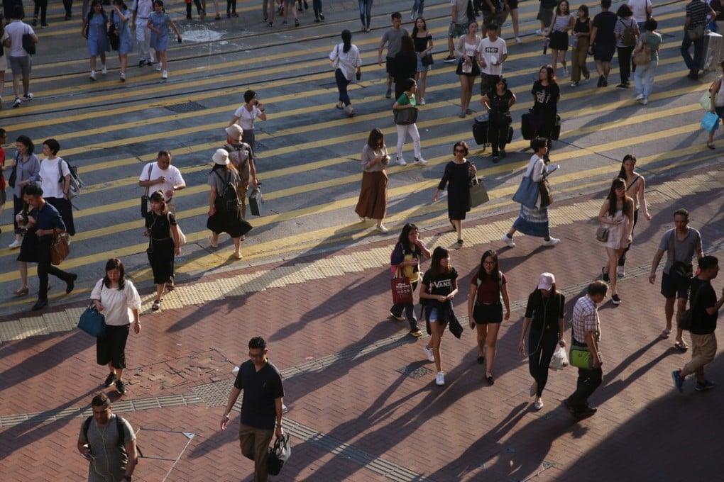 Pedestrians walk on street in Causeway Bay on 27 September, 2017. Photo: SCMP / Sam Tsang