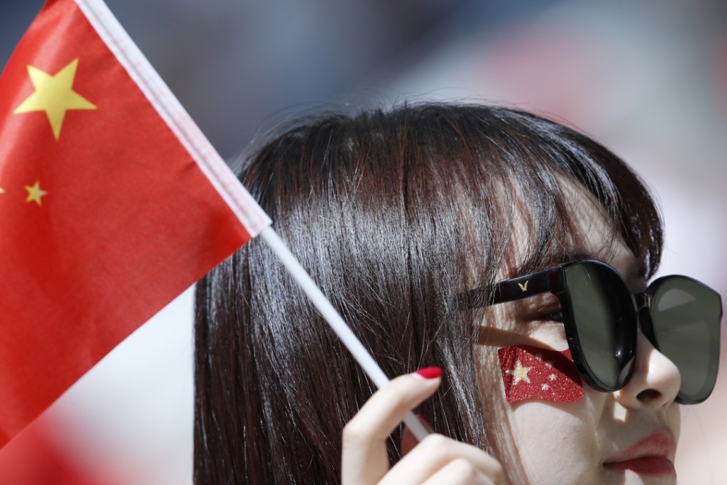 Chinese flags will be flying in the crucial game against North Korea. Photo: AP