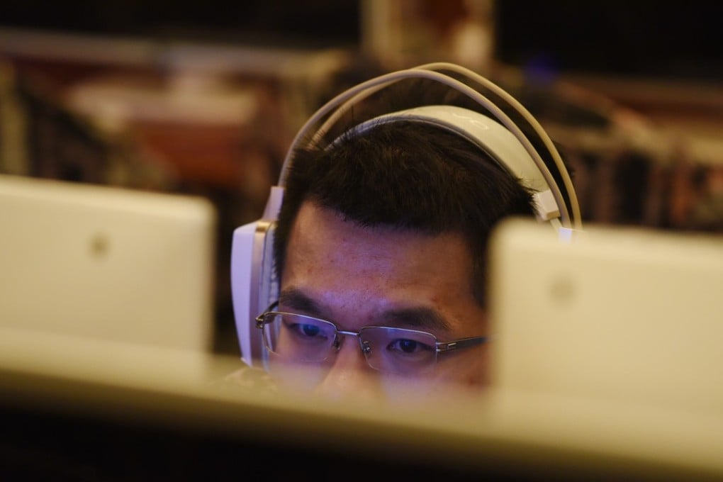 A man uses a computer in an internet cafe in Beijing. In the first half of the year, China’s market watchdogs had investigated over 8,100 cases of illegal and deceptive advertising, up 64.2 per cent year-on-year. Photo: AFP