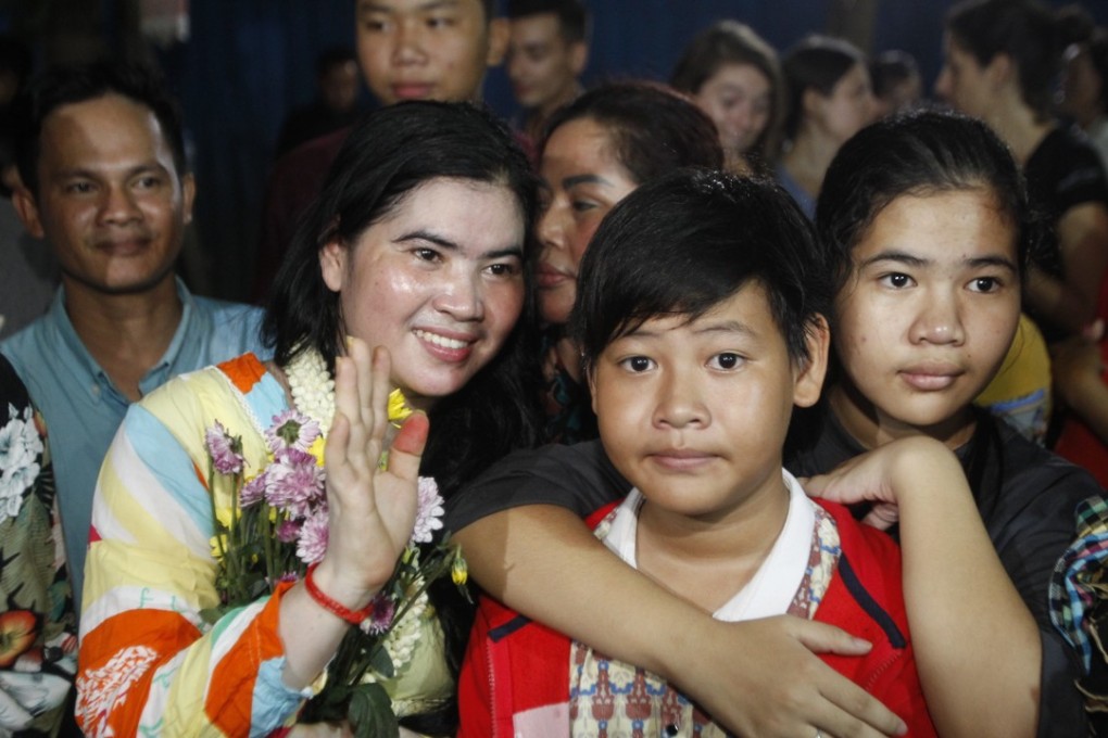 Tep Vanny waves as she arrives home in Boeung Kak, Cambodia. Photo: AP