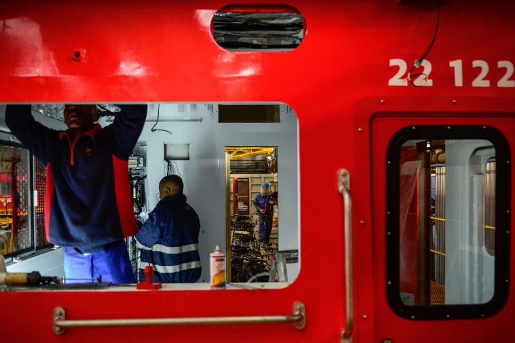 Chinese and South African technicians work inside a locomotive to be assembled at a Transnet Engineering plant in Pretoria, South Africa, in July last year. Economic ties between China and African countries have deepened under the Belt and Road Initiative, a Chinese effort to take its infrastructure building and other capabilities beyond borders. Photo: Xinhua