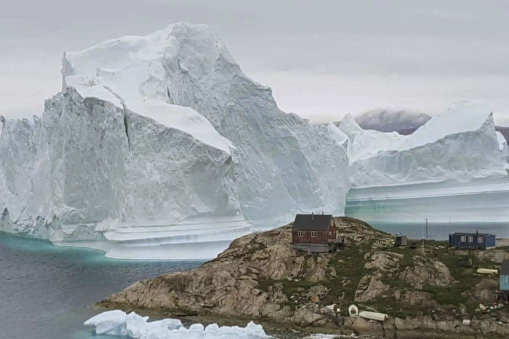 A giant iceberg that has drifted towards an Innaarsuit settlement in west Greenland. Photo: AP