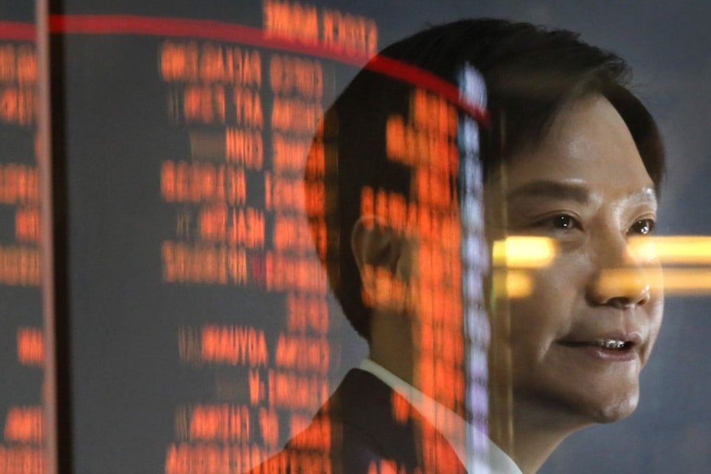 Xiaomi's Founder, Chairman and CEO Lei Jun receives an interview after the listing ceremony at the Hong Kong stock exchange in Hong Kong Monday, July 9, 2018. (AP Photo/Vincent Yu)