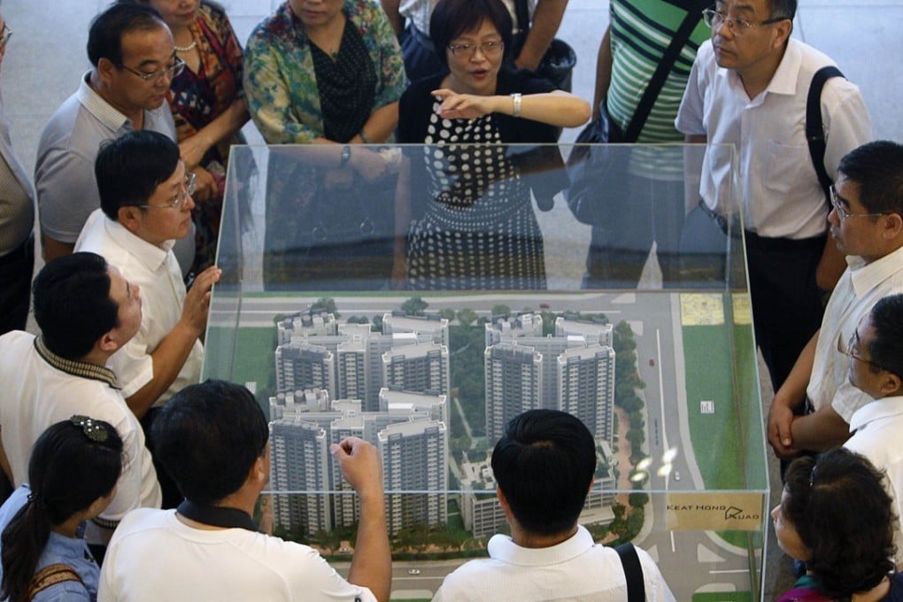 A model of a public housing estate at the Housing Development Board (HDB) gallery in Singapore. Photo: Reuters