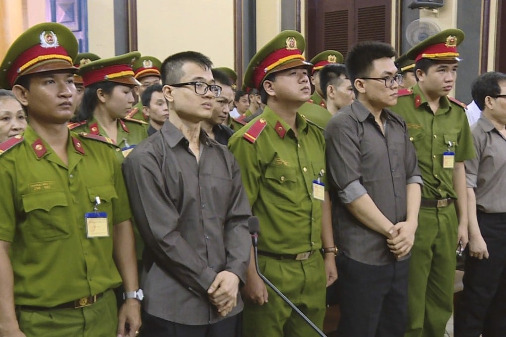 Alleged members of the Provisional Central Government of Vietnam, US-based exile group, standing trial in Ho Chi Minh City, Vietnam, on Tuesday. Photo: Vietnam News Agency via AP