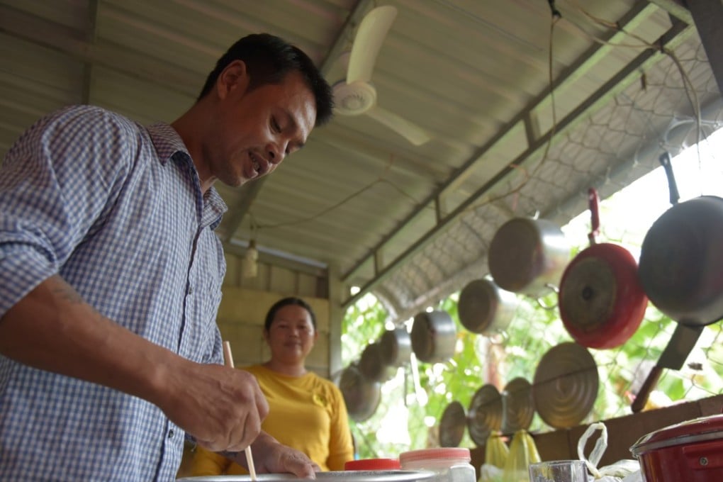 A Cambodian refugee who was deported from the US prepares dough as he makes pizza for a group of other deportees in Battambang, Cambodia. Photo: AFP