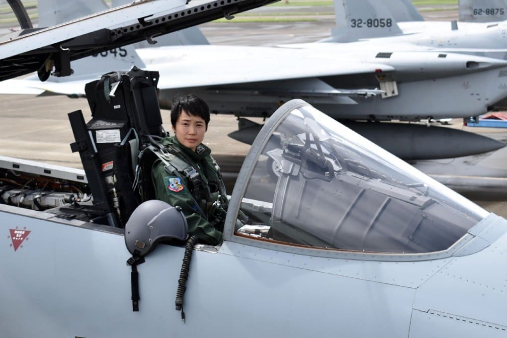 First Lieutenant Misa Matsushima of the Japan Air Self Defence Force poses in the cockpit of an F-15. Photo: AFP