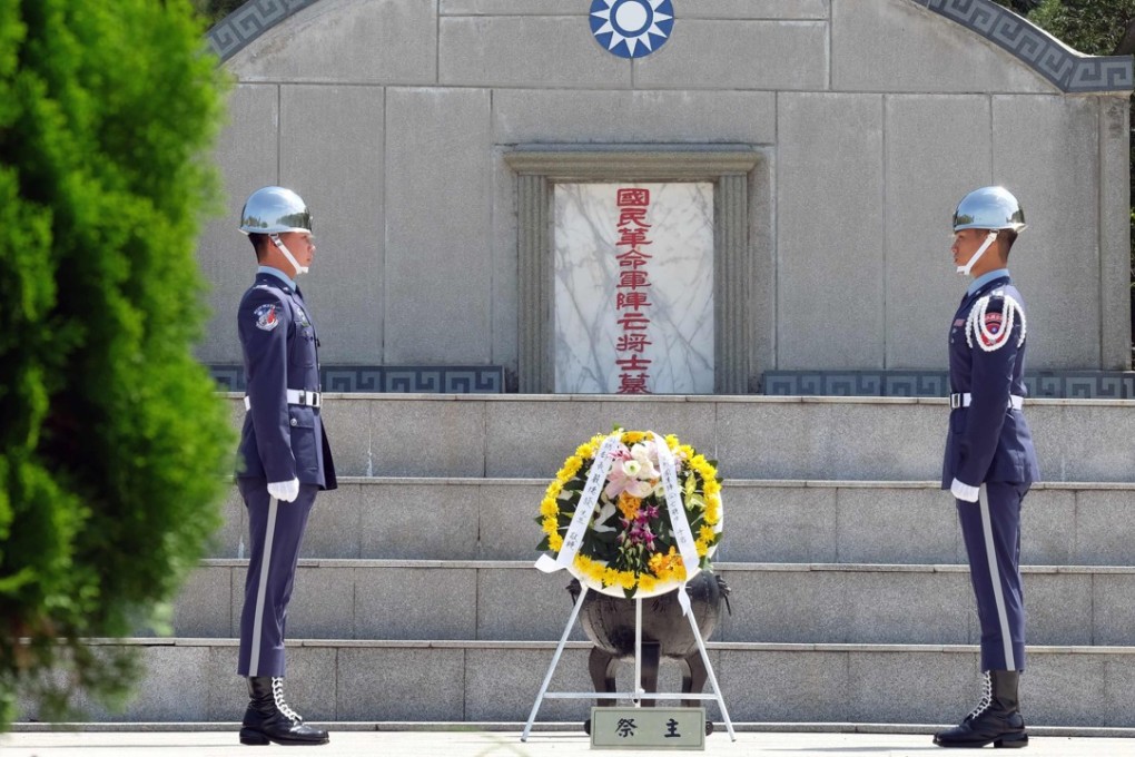 Taiwanese soldiers stand in front of a monument to the cemetery of the National Revolutionary Army during the 60th anniversary of the attack in Quemoy on Thursday. Photo: AFP