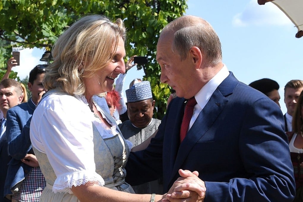 Russian President Vladimir Putin dances with Austrian Foreign Minister Karin Kneissl. Photo: EPA
