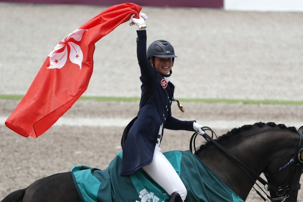 Jacqueline Siu does a victory lap after winning the individual dressage at the Asian Games on her horse, Jockey Club Fuerst On Tour. Photos: Reuters