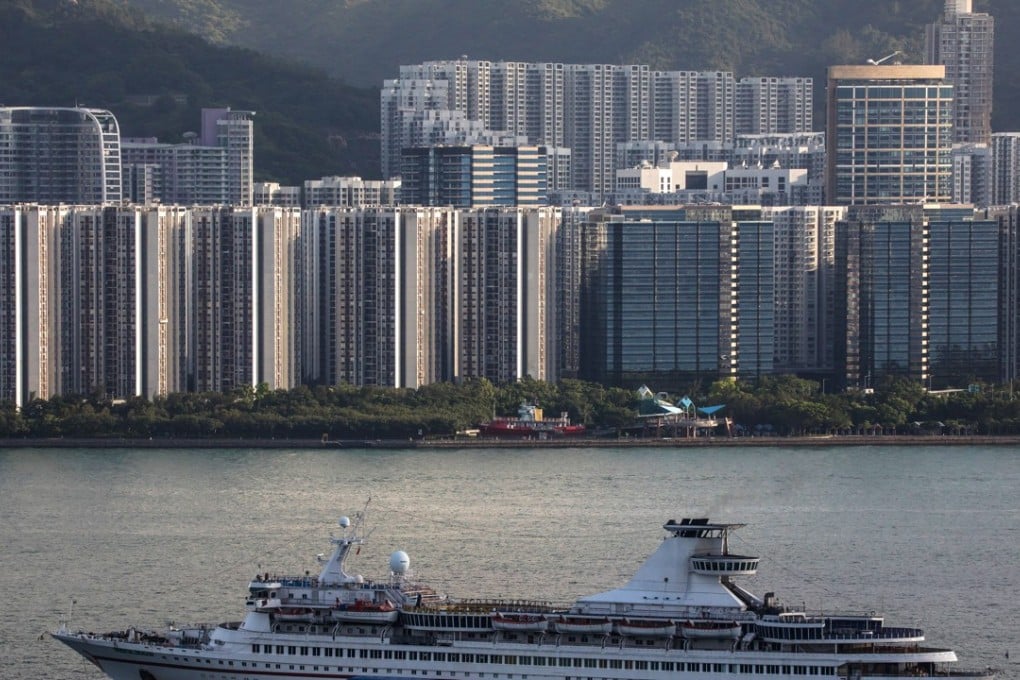 The Metropolis Cruise Group Oriental Dragon cruise ship sits anchored in front of residential buildings in Hong Kong on July 20, 2018. Photo: Bloomberg