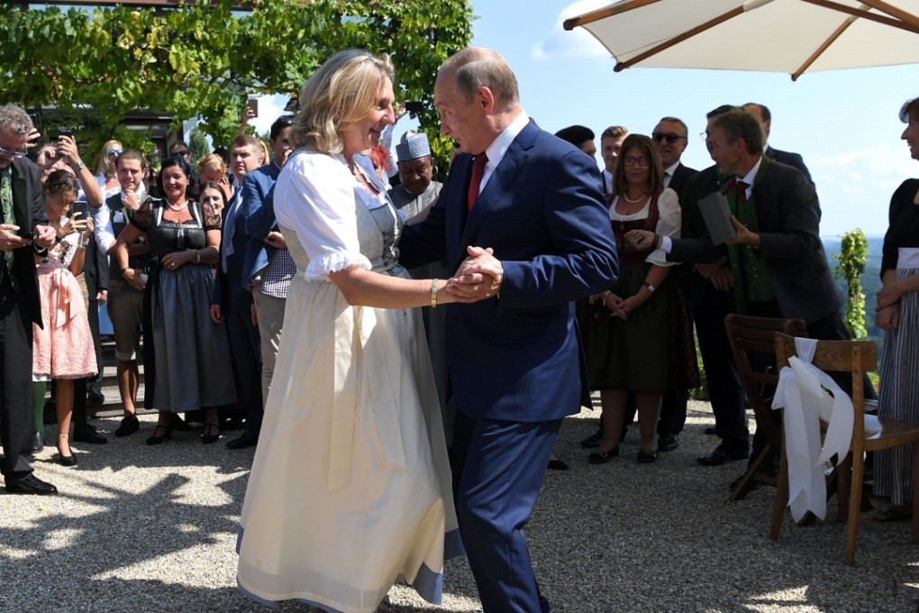 Austria's Foreign Minister Karin Kneissl dances with Russia's President Vladimir Putin at her wedding in Gamlitz, Austria, on August 18. Photo: Reuters
