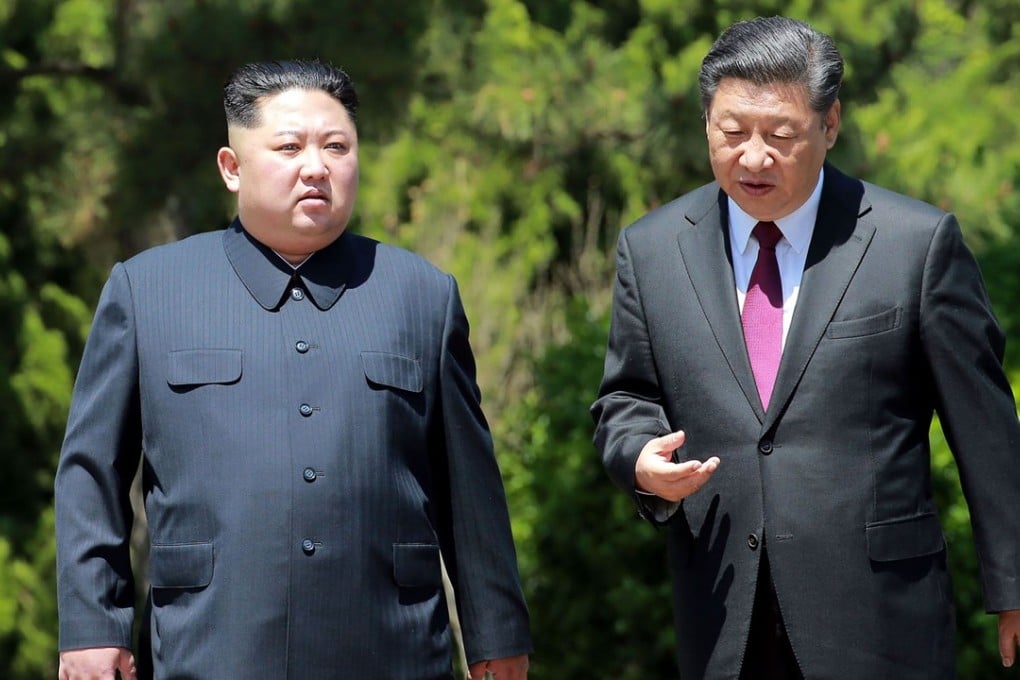 North Korean leader Kim Jong-un in a pinstripe buttoned-up suit and Chinese President Xi Jinping in a traditional Western suit-and-tie combination when the pair met in Beijing, China in May. Photo: AFP