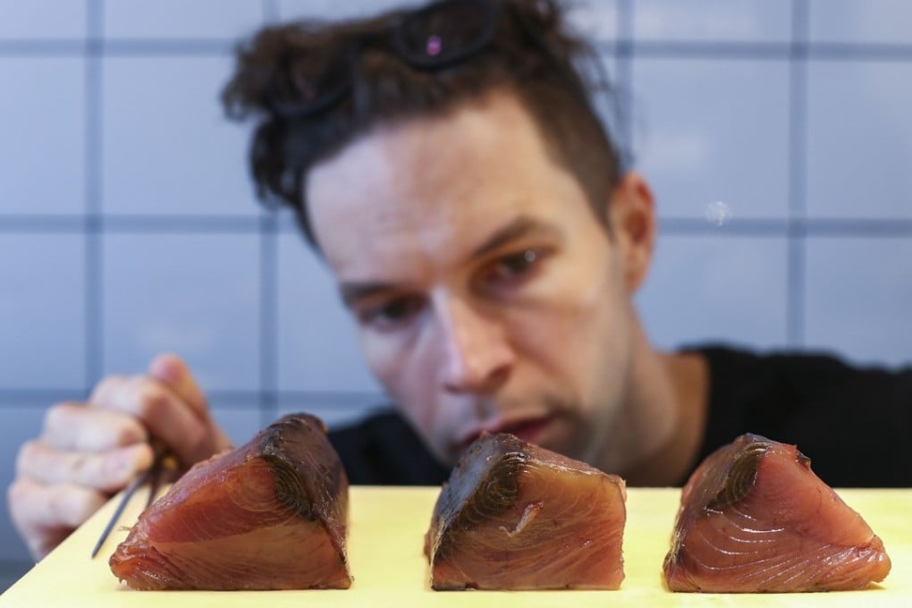 Chef Max Levy serves dry aged bonito at Okra Bar, in Sai Ying Pun, Hong Kong. Picture: Nora Tam