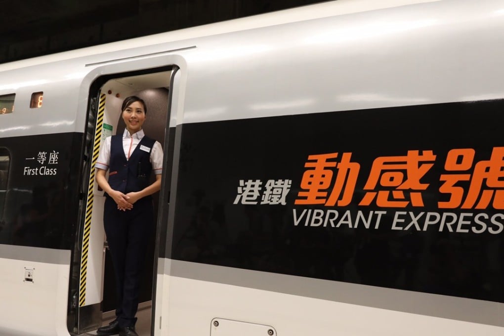 An attendant stands on a train of the Guangzhou-Shenzhen-Hong Kong Express Rail Link after the successful completion of a trial run of the Hong Kong section of the track. Photo: Xinhua/Lui Siu Wai