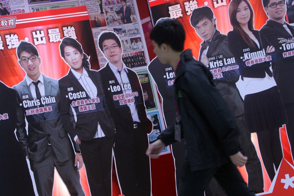A student walks past advertising featuring star tutors at a centre in Sha Tin. Photo: K.Y. Cheng