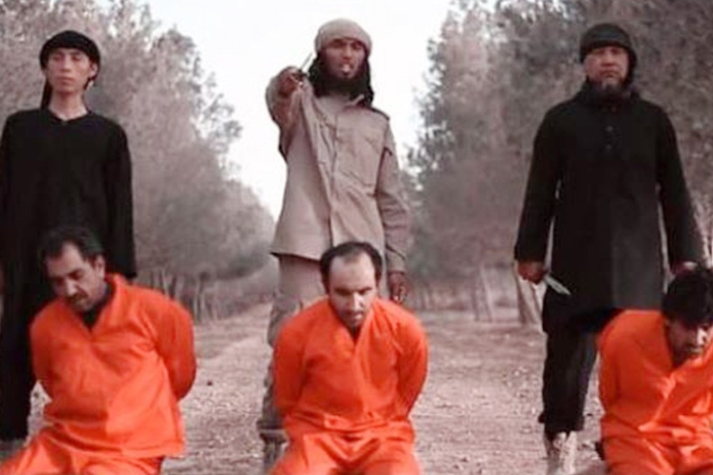 A screenshot of the video with Malaysian jihadist Mohamad Rafi Udin standing on the right.