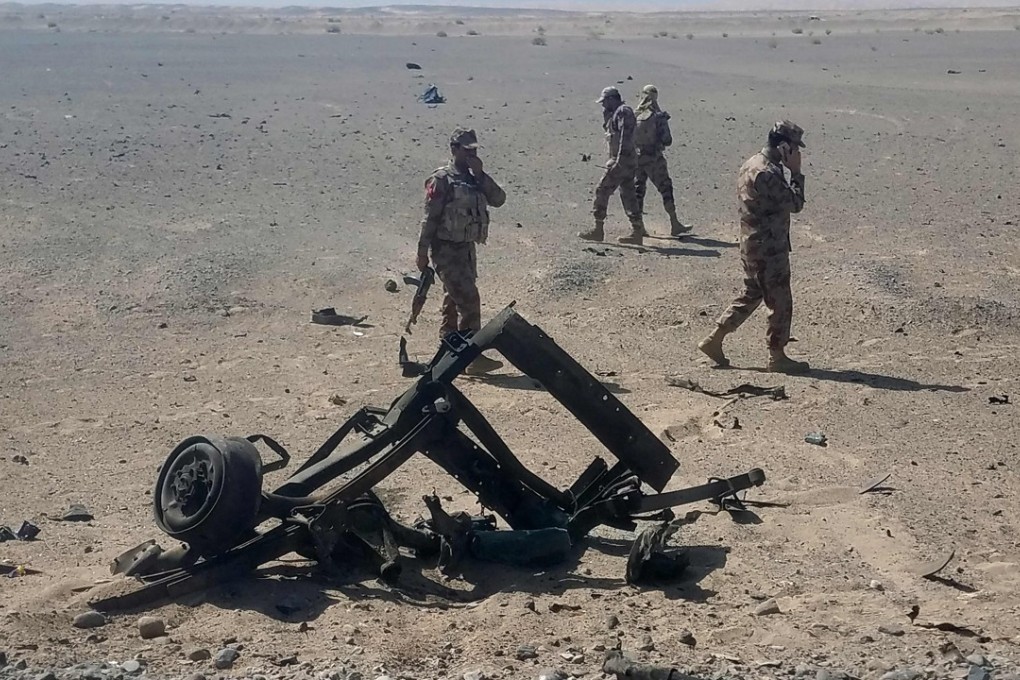 Pakistani security personnel inspect the site of a suicide attack that wounded at least five people, including two Chinese nationals. Photo: AFP
