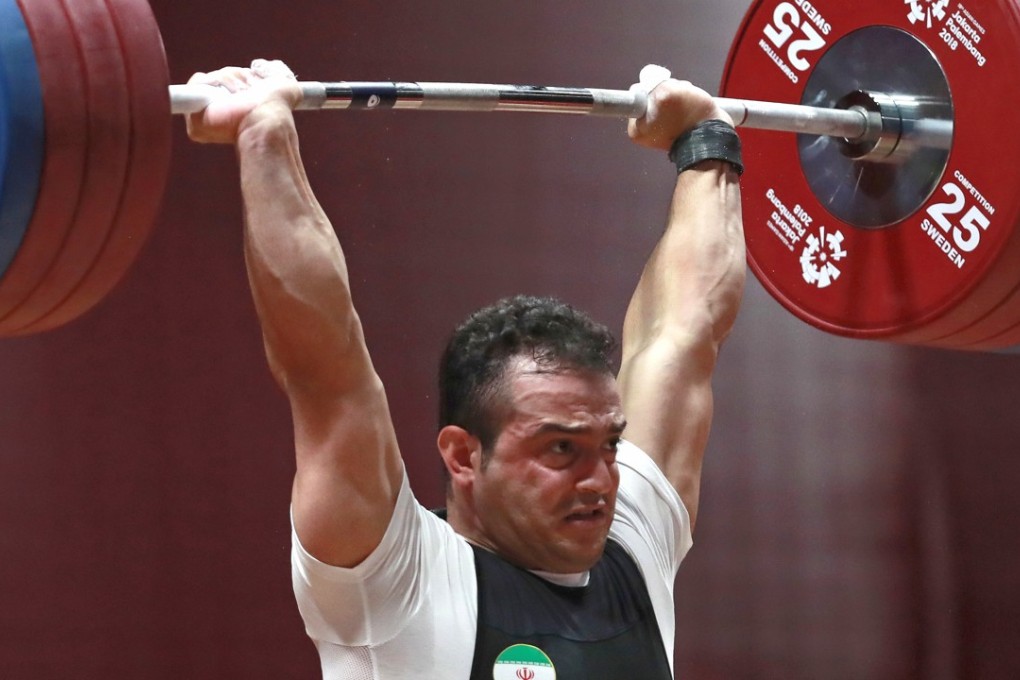Iran’s Sohrab Moradi competes during the 94-kilogram weightlifting at the 2018 Asian Games in Jakarta, where he set a new world record. Photo: AP