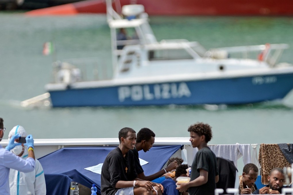 Migrants on the deck of the Italian Coast Guard vessel “Diciotti” in the Sicilian port of Catania, this week. Photo: AFP