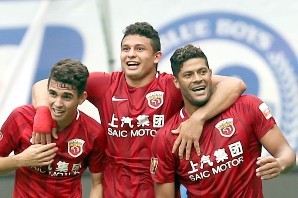 Oscar, Elkeson and Hulk of Shanghai SIPG celebrate a goal in the Chinese Super League. Photo: Xinhua