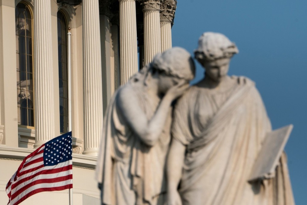 A flag flies at half mast at the Capitol US dome in honour of the late US Senator John McCain. Photo: AFP