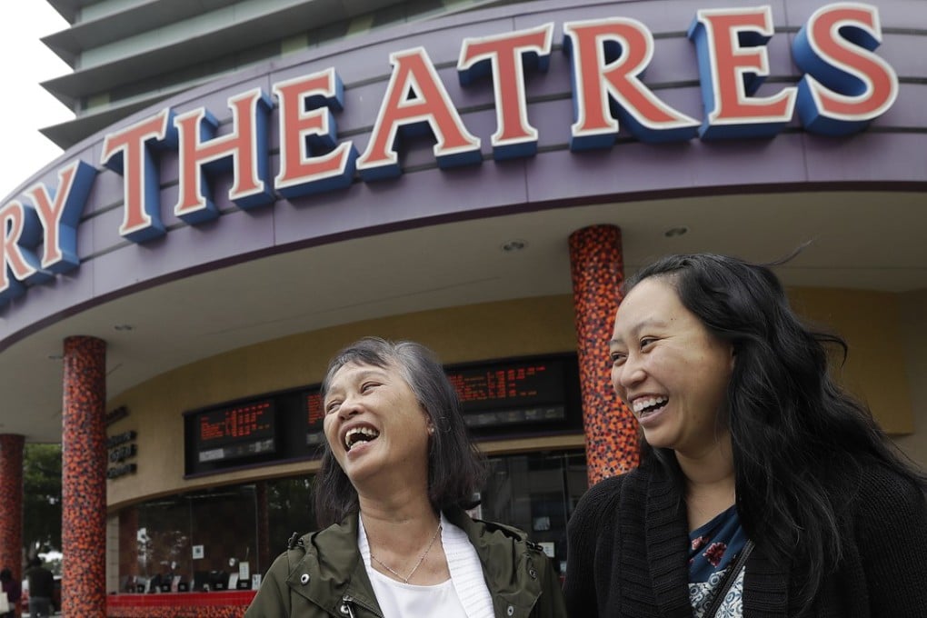 Alice Sue, left, and her daughter Audrey Sue-Matsumoto laugh while being interviewed after watching the movie Crazy Rich Asians in Daly City, California, last week. Photo: AP