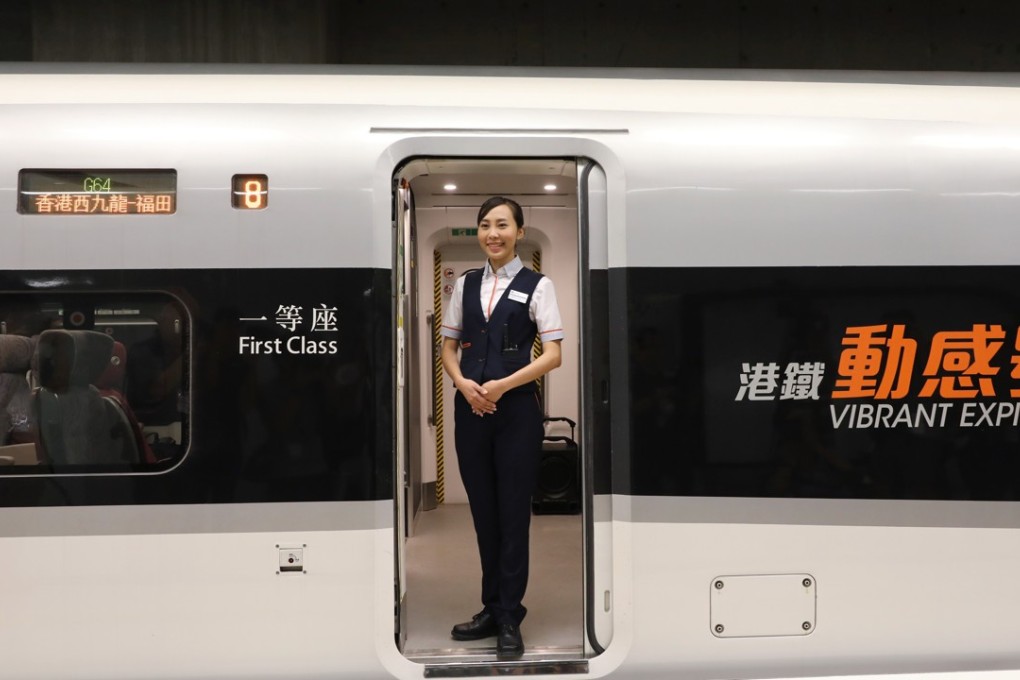 An attendant waits in the doorway of one of the trains that will run on the Guangzhou-Shenzhen-Hong Kong Express Rail Link, after trial runs at the West Kowloon Terminus on August 16. The rail link will begin service on September 23. Photo: Sam Tsang