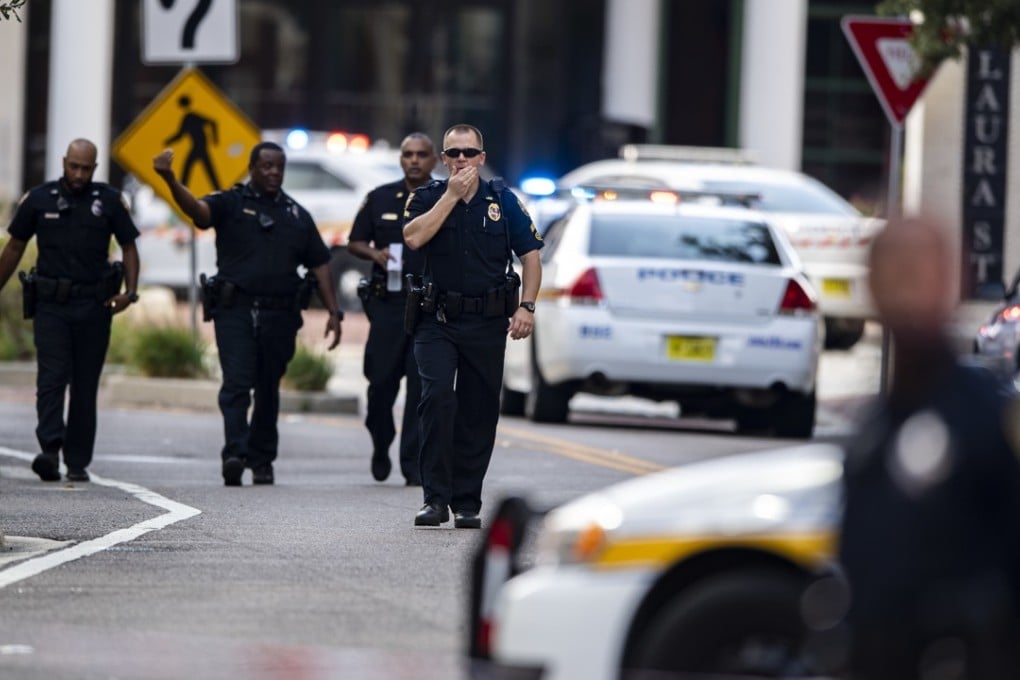 Police gather after an active shooter was reported at the Jacksonville Landing in Jacksonville, Florida on Sunday. Photo: AP