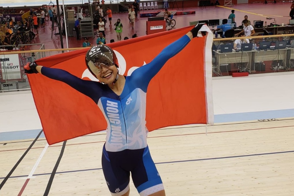 Sarah Lee with the Hong Kong flag soon after finishing her race. Photo: HKSF&OC