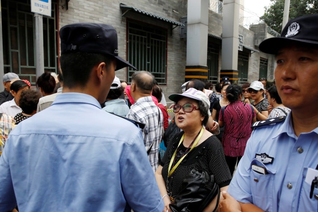 Retail investors protest in Beijing on Monday over losses incurred in P2P investment schemes. Photo: Reuters
