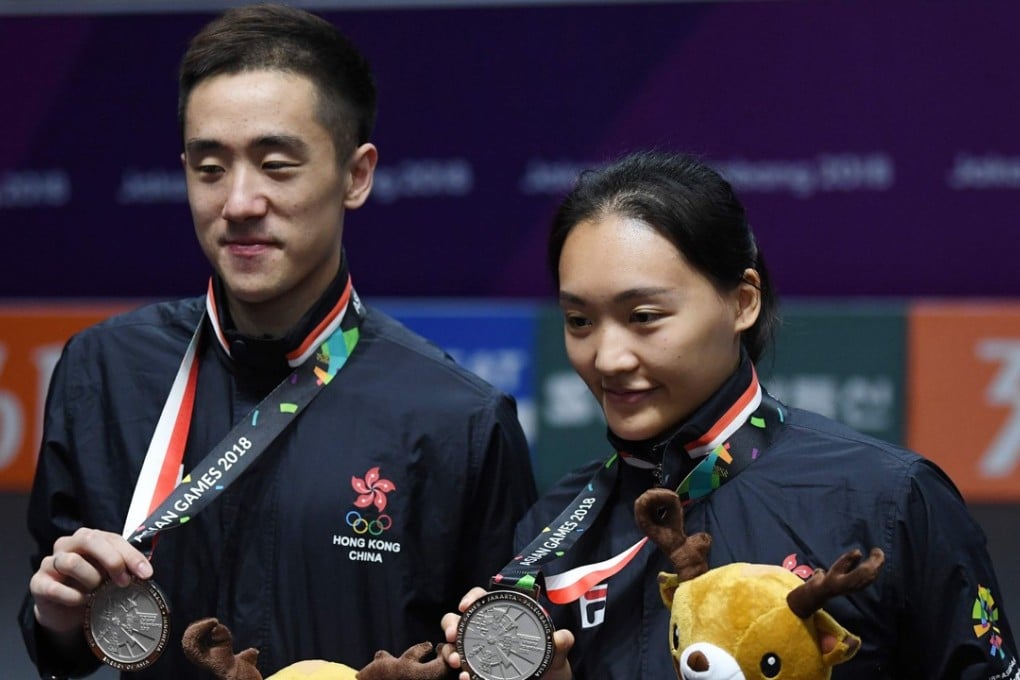 Tang Chun-man (left) and Tse Ying-suet with their silver medals. Photo: AFP
