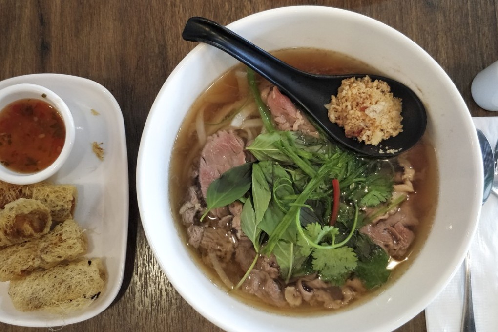 Pork net spring rolls and pho bo at Noodle Lah! in Wan Chai.
