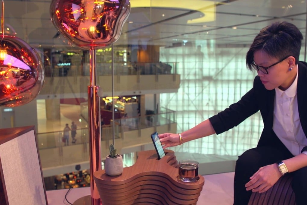 Florence Kong, founder of architecture and design studio Fab-A-Matter, shows how the Chi coffee table she has designed for the IoT (internet of things) in Style at HKT Premier’s showroom at the io.t by HKT Concept Store.