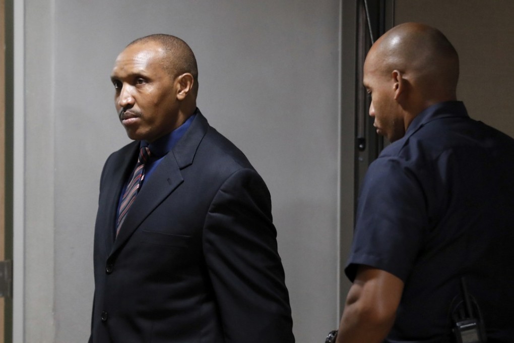 Bosco Ntaganda (left) enters the courtroom of the International Criminal Court. Photo: AP