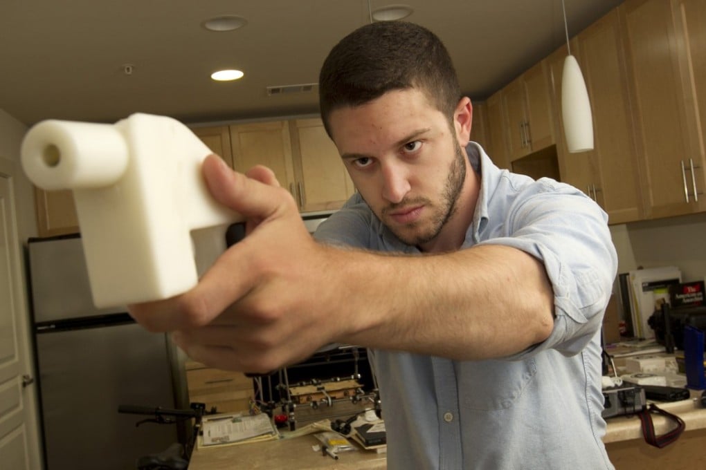 Cody Wilson with a 3D-printed handgun, The Liberator, at his home in Austin, Texas. Photo: TNS