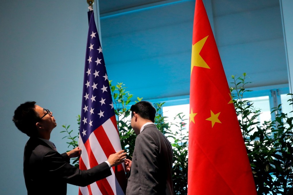 Chinese officials prepare the flags for a China-US meeting on the sidelines of the G20 leaders’ summit in Hamburg, Germany, in July last year. US President Donald Trump has made no secret of his views on China’s currency policy, saying often that Beijing manipulates its currency as a trade advantage. Photo: Reuters