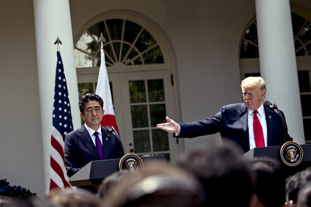 US President Donald Trump speaks as Shinzo Abe, Japan's prime minister, left, listens during a news conference in the Rose Garden of the White House in Washington on June 7, 2018. Photo: Bloomberg