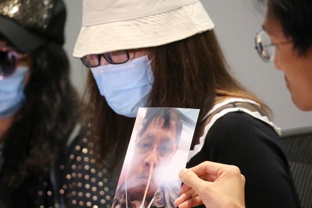 The grieving daughter (centre) and wife of Tong, a patient who died at Tuen Mun Hospital, speak to the media. Photo: Dickson Lee