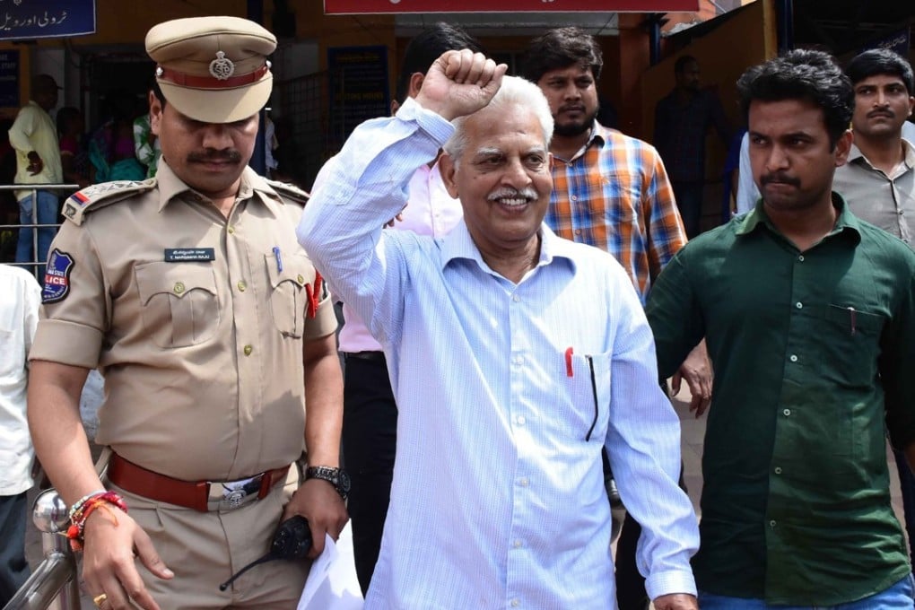 Indian poet and activist Varara Rao is escorted after his arrest in Hyderabad on Tuesday. Photo: AFP