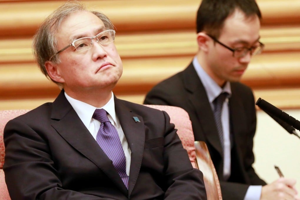 Japanese Vice Foreign Minister Takeo Akiba during a meeting with Chinese Foreign Minister Wang Yi in Beijing, China on Wednesday. Photo: Reuters