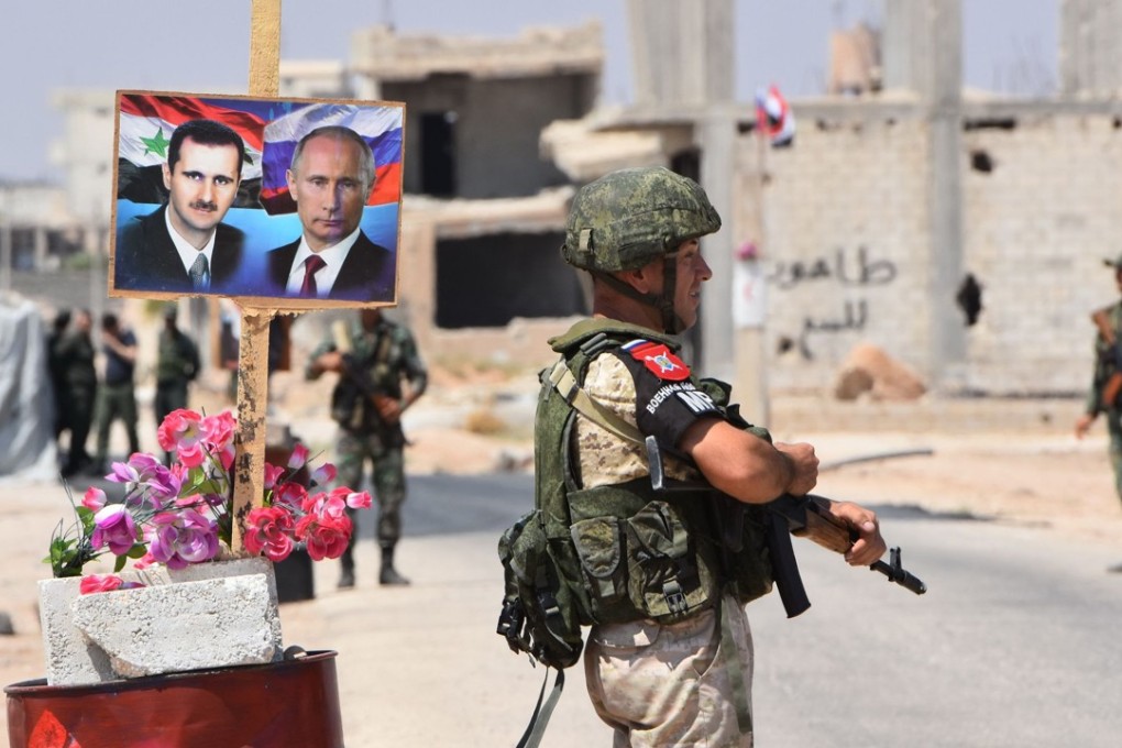 Russian and Syrian forces stand guard on the eastern edge of Idlib province. Photo: AFP
